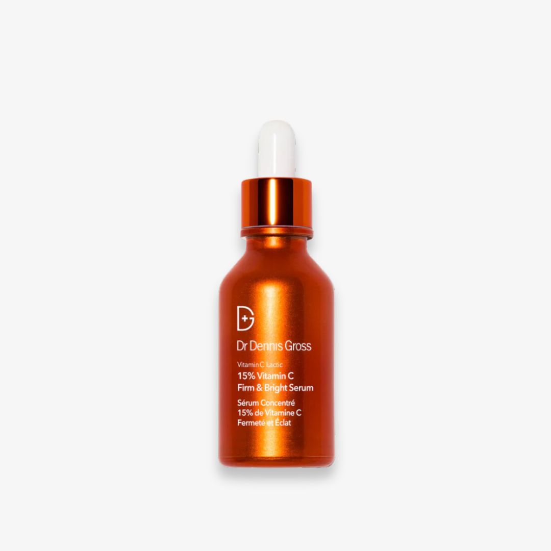 Brown serum bottle with dropper labeled "Dr. Dennis Gross Vitamin C Firm & Bright Serum".